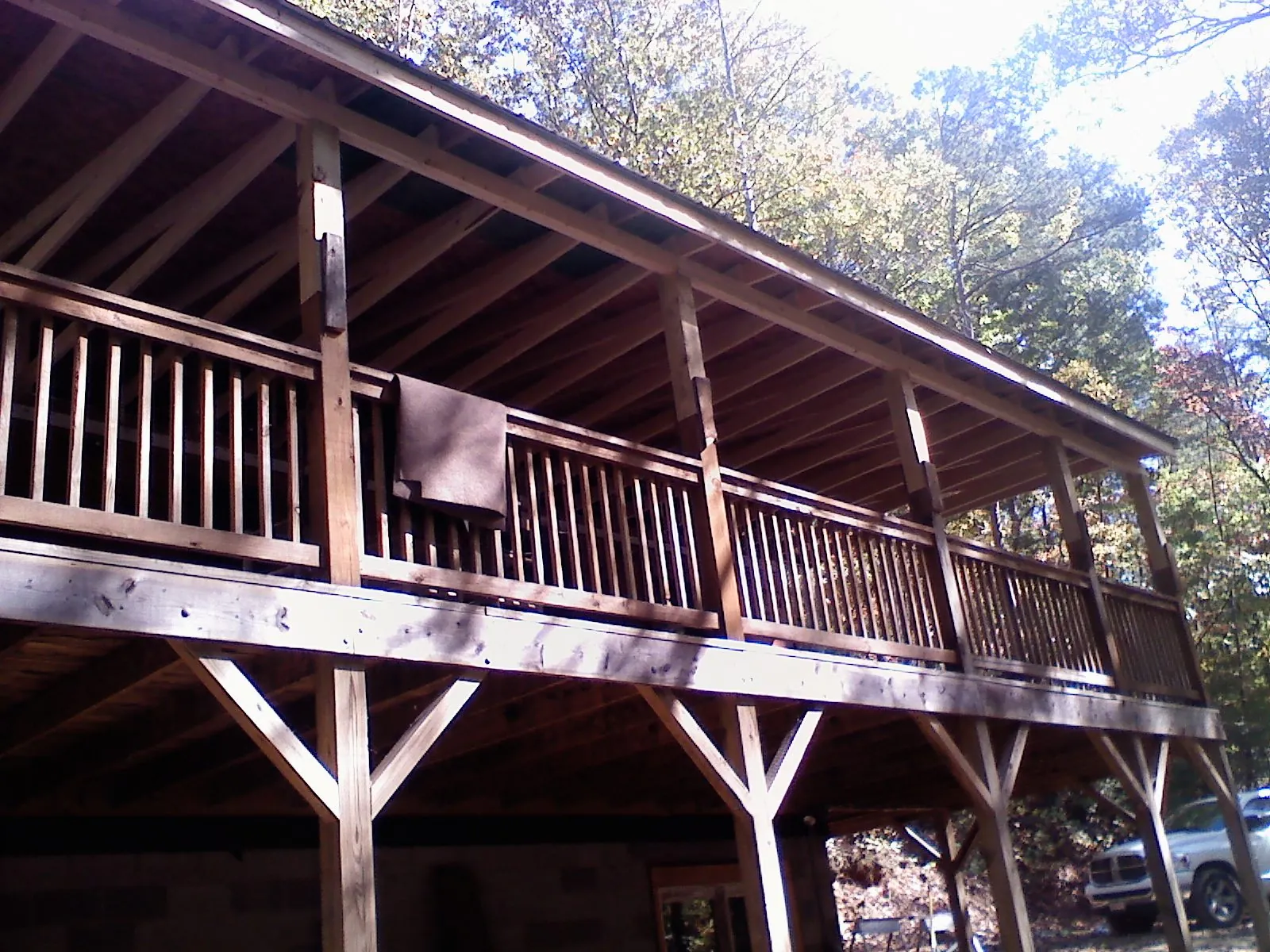 Timber framing under a new elevated porch and deck in Latham